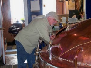 Kirby Nelson, brewmaster at the new Wisconsin Brewing Co. in Verona and former brewmaster at Capital Brewing Co., keeps an eye on the brew.