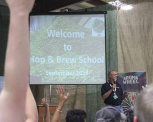 HU prez Don Bryant answers questions following his hops market talk.