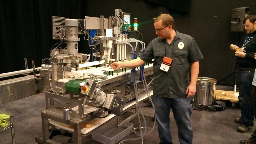 Owen running the mobile canning line.  Notice the trash can of Bloody Mary mix in the back!